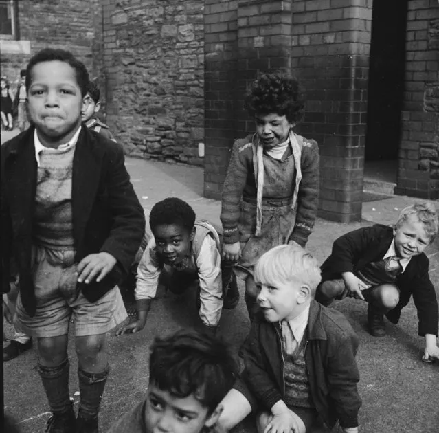 Young children of various race playing in a school playground, in Cardiff, Wales, circa 1955. (Photo by Werner Rings/BIPs/Getty Images)