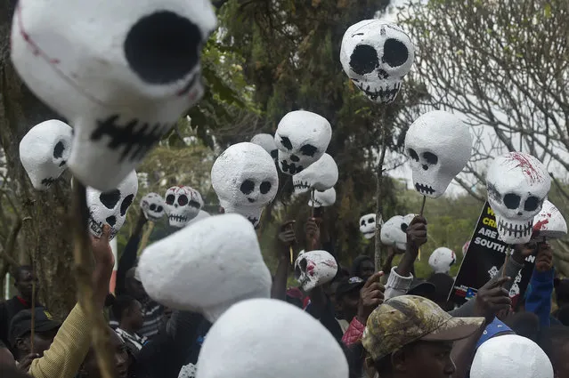 South Sudanese citizens living in Kenya hold up mock skulls as they demonstrate in the capital Nairobi, on October 11, 2018, to request the Kenyan government to freeze assets of South Sudan leaders involved in the ongoing conflict in their country. (Photo by Simon Maina/AFP Photo)