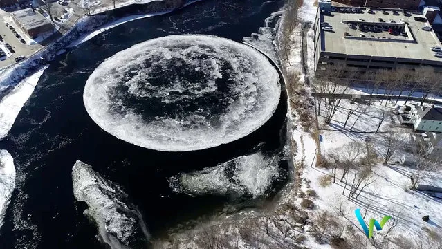A massive ice disc formed on the surface of Presumpscot River is seen in Westbrook, Maine, U.S., January 14, 2019 in this still image taken from a social media video obtained January 16, 2019. (Photo by Tina Radel via Reuters)