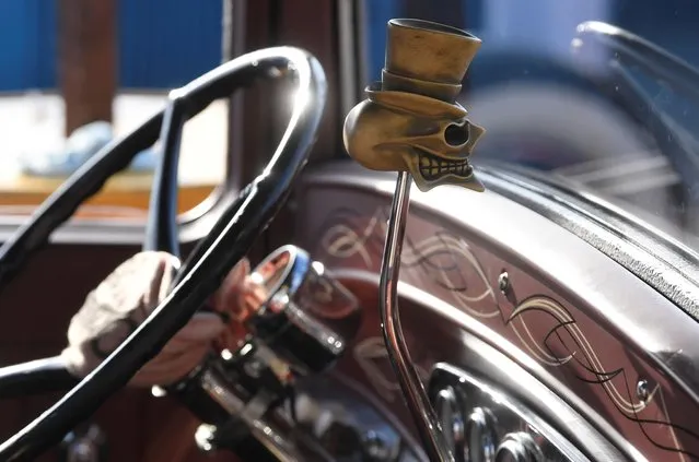Details of a car gear stick is pictured, as motoring enthusiasts attend the Goodwood Revival, a three-day historic car racing festival in Goodwood, Chichester, southern Britain, September 17, 2021. (Photo by Toby Melville/Reuters)