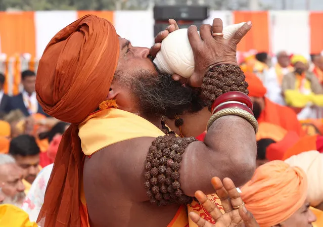 A handout photo made available by the Indian press information bureau showing showing Indian persist blowing the Shankh or shell during the ceremony at the lord Ram temple in Ayodhya, Uttar Pradesh, India on January 22, 2024. New Ram Lalla idol was consecrated at Ayodhya temple during the Pran Pratistha ceremony, or the inauguration. Pran Pratistha is the act which transforms an idol into a deity, giving it the capacity to accept prayers, which was performed by Indian Prime Minister Narendra Modi. (Photo by Press Information Bureau Handout/EPA/EFE/Rex Features/Shutterstock)
