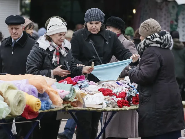 Women browse an underwear stall at a street market in Kiev, Ukraine, March 2, 2016. (Photo by Gleb Garanich/Reuters)