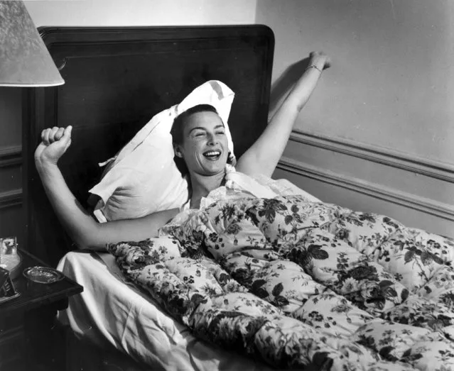 American tennis player Gertrude Moran, or Gorgeous Gussie, waking up in her Paris hotel room, 3rd June 1950 (Photo by Bert Hardy/Picture Post/Getty Images)