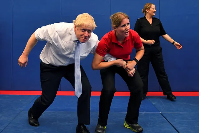 Boris Johnson, a leadership candidate for Britain's Conservative Party, reacts as he visits the Thames Valley Police Training Centre in Reading, Britain, July 3, 2019. (Photo by Dylan Martinez/Reuters/Pool)