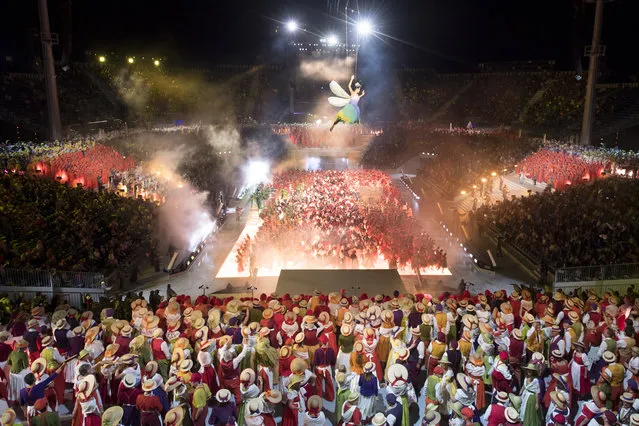 Extras perform in the arena of the “Fete des Vignerons” (winegrowers' festival) during a rehearsal in Vevey, Switzerland, 16 July 2019 (issued 17 July 2019). (Photo by Laurent Gilliéron/EPA/EFE)