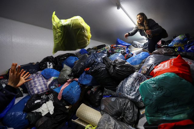 People work as Turkish community residents in Berlin, one the world's largest communities outside of Turkey, collect bags and boxes with warm clothes and other valuable goods to support victims of the deadly earthquake in Turkey, at a neighbourhood in Berlin, Germany on February 7, 2023. (Photo by Fabrizio Bensch/Reuters)