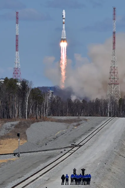 A Russian Soyuz 2.1a rocket carrying Lomonosov, Aist-2D and SamSat-218 satellites lifts off from the launch pad at the new Vostochny cosmodrome outside the city of Uglegorsk, about 200 kilometers (125 miles)  from the city of Blagoveshchensk in the far eastern Amur region Thursday, April 28, 2016. (Photo by Kirill Kudryavtsev/Pool Photo via AP Photo)