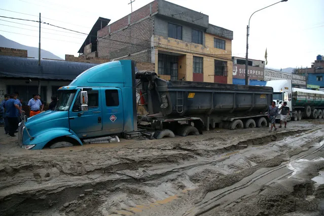 A truck is seen at the Central highway after a landslide and flood in Chosica, east of Lima, Peru on March 17, 2017. (Photo by Guadalupe Pardo/Reuters)