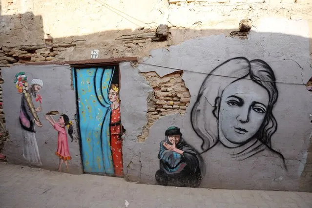 A view of a mural in the Al-Anbarieen heritage neighbourhood in Baghdad's Khadimiya city, Iraq, 16 November 2021. (Photo by Ahmed Jalil/EPA/EFE)