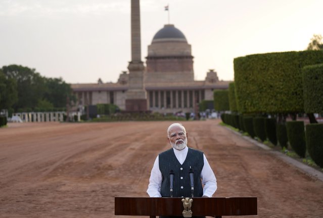 Indian Prime Minister Narendra Modi speaks to the media outside the Rashtrapati Bhavan after receiving a letter from the President of India, Draupadi Murmu, inviting him to form the next central government, in New Delhi, India, Friday, June 7, 2024. (Photo by Manish Swarup/AP Photo)