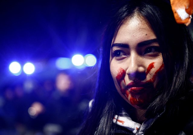 A demonstrator takes part in an International Women's Day rally, as women strike to demand the end to domestic and racist violence, wars and the country's prevailing “macho” culture, in Rome, Italy on March 8, 2023. (Photo by Yara Nardi/Reuters)