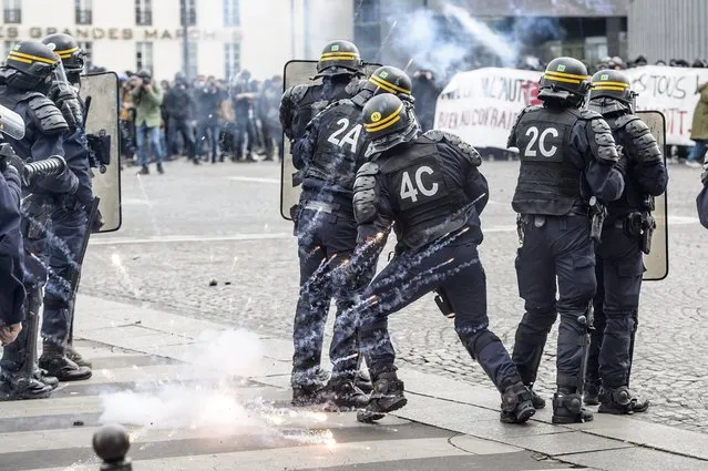 Clashes erupt between protesters and French anti-riot police during a May Day demonstration against French far-right in Paris, France, 01 May 2017. Thousands of people demonstrated against the presence of Far-right Front National (FN) party candidate Marine Le-Pen for the second turn of the presidential elections. Labor Day or May Day is observed all over the world on the first day of the May to celebrate the economic and social achievements of workers and fight for laborers rights. (Photo by Christophe Petit Tesson/EPA)