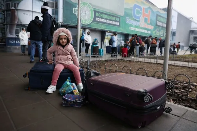 People wait to return to the city at Kyiv Airport after Russian President Vladimir Putin authorized a military operation in eastern Ukraine, February 24, 2022. (Photo by Umit Bektas/Reuters)