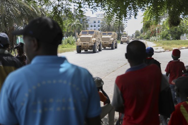 Kenyan police officers who are part of a UN-backed multinational force drive through the streets in armored vehicles in Port-au-Prince, Haiti, July 17, 2024. (Photo by Odelyn Joseph/AP Photo)