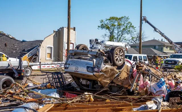 A car flipped upside down is seen after a tornado in Arabi, New Orleans, Louisiana, the United States, March 23, 2022. At least one person was killed and multiple injured after tornado moved into southern U.S. state Louisiana and struck parts of the state's biggest city New Orleans and its suburbs on Tuesday night, officials said on Wednesday. (Photo by Xinhua News Agency/Rex Features/Shutterstock)