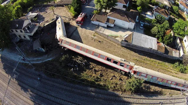A train has toppled on its side after derailing and crashing into a house in the town of Adendro in northern Greece, May 14, 2017. (Photo by Petros Kefalas/Reuters/Emvolos.gr)