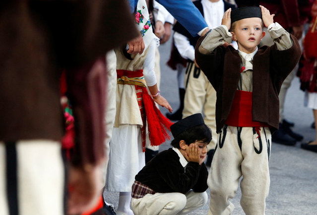 People dressed in folk costumes take part in a traditional three-day wedding ceremony held on every “Petrovden”, or St. Peter's Day, in Galicnik, North Macedonia, on July 13, 2024. (Photo by Ognen Teofilovski/Reuters)