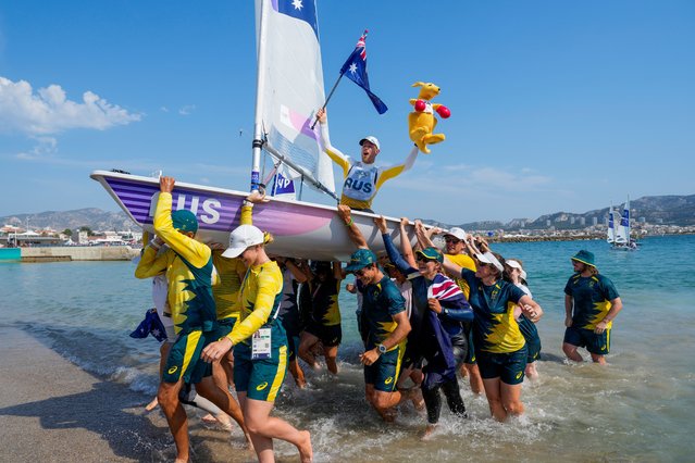 Matthew Wearn of Australia celebrates after winning the gold medal at the end of the ILCA 7 men's dinghy class final race during the 2024 Summer Olympics, Wednesday, August 7, 2024, in Marseille, France. (Photo by Jacquelyn Martin/AP Photo)