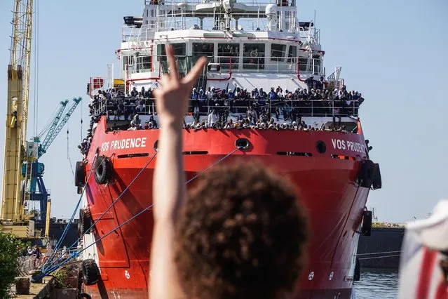The rescue ship VOS Prudence run by the NGO Medecins Sans Frontieres (MSF) is moored at the Naples harbor, Italy, as migrants wait to be disembarked Sunday, May 28 2017.  On Thursday the VOS Prudence rescued 1,449 people in 12 different operations. MSF also reported a very difficult situation onboard because they had to navigate for 2 days as it was not allowed to dock in any Sicilian port due to the G7 summit. (Photo by Cesare Abbate/ANSA via AP Photo)