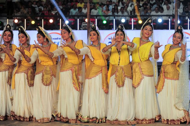 Cultural dancers perform during the opening ceremony of Khelo India University Games 2021, at the Kanteerava Indoor Stadium in Bangalore on April 24, 2022. (Photo by Manjunath Kiran/AFP Photo)