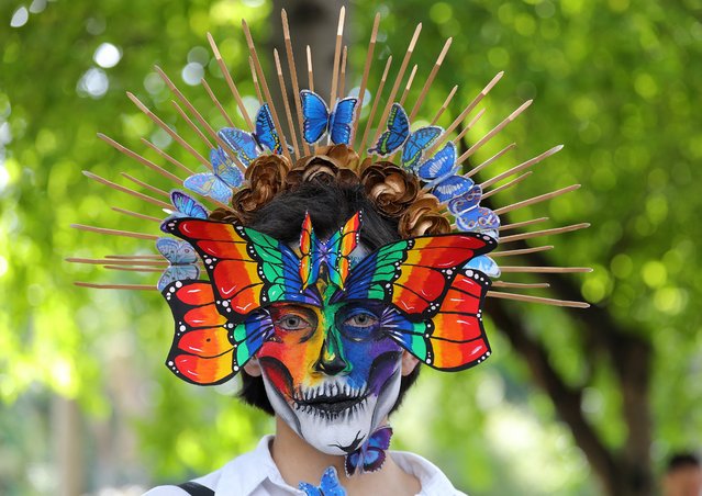 A supporter of the Lesbian, Gay, Bisexual and Transgender (LGBT+) community participates in the Pride parade in the city of Medellin, Colombia, on June 30, 2024. (Photo by Jaime Saldarriaga/AFP Photo)