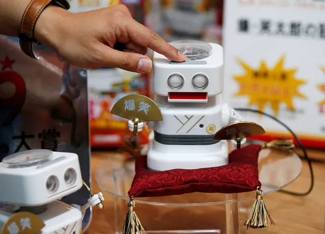 Takara Tomy's clock robot “Baku Shotaro” which can crack jokes, is seen at the International Tokyo Toy Show in Tokyo, Japan June 9, 2016. (Photo by Toru Hanai/Reuters)