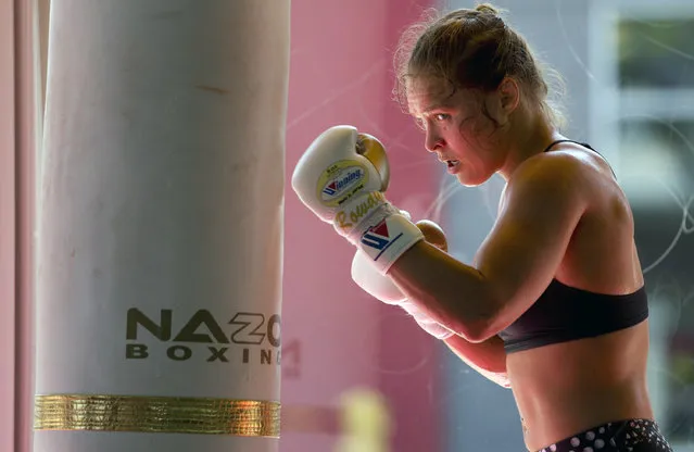 This July 15, 2015, file photo shows mixed martial arts fighter Ronda Rousey working out at Glendale Fighting Club in Glendale, Calif. Paramount Pictures said Monday, August 3, that it has acquired the rights to Rousey's autobiography “My Fight/Your Fight”, with plans for Rousey to play herself in the adaptation. (Photo by Jae C. Hong/AP Photo)