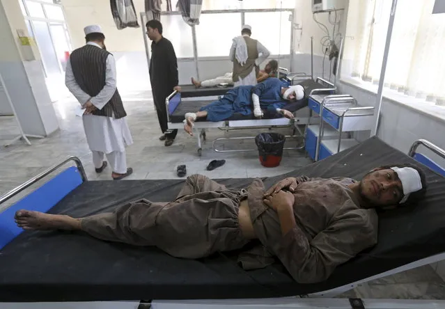 Afghan men receive treatment at a hospital after a suicide truck bomb attack in Kabul, Afghanistan August 7, 2015. The Afghan war between the foreign-backed government and the Taliban has intensified since the NATO combat mission ended last year and most foreign troops were withdrawn. (Photo by Omar Sobhani/Reuters)