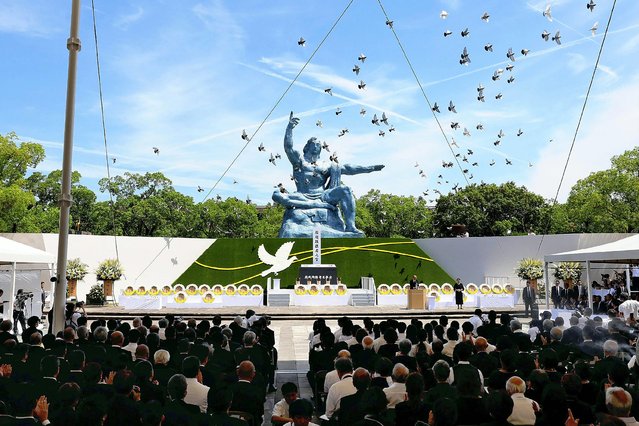 Pigeons are released during a peace prayer ceremony at the Peace Park in Nagasaki on August 9, 2024, during ceremonies to mark the 79th anniversary of the atomic bombing of the city. (Photo by JIJI Press/AFP Photo)