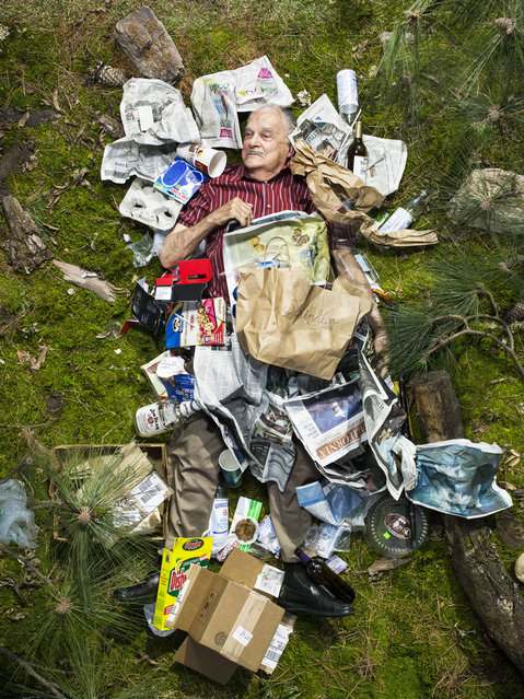 Milt surrounded by seven days of his own rubbish in Pasadena, California.  (Photo by Gregg Segal/Barcroft Media)