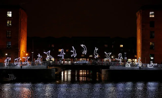 An car drives past an installation called “Run Beyond” which forms part of the River of Light festival in Liverpool, Britain, October 31, 2019. (Photo by Phil Noble/Reuters)