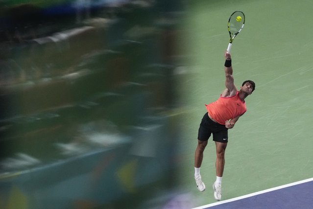 Carlos Alcaraz of Spain serves against Tomas Machac of the Czech Republic during the men's singles quarterfinals match in the Shanghai Masters tennis tournament at Qizhong Forest Sports City Tennis Center in Shanghai, China, Thursday, October 10, 2024. (Photo by Andy Wong/AP Photo)