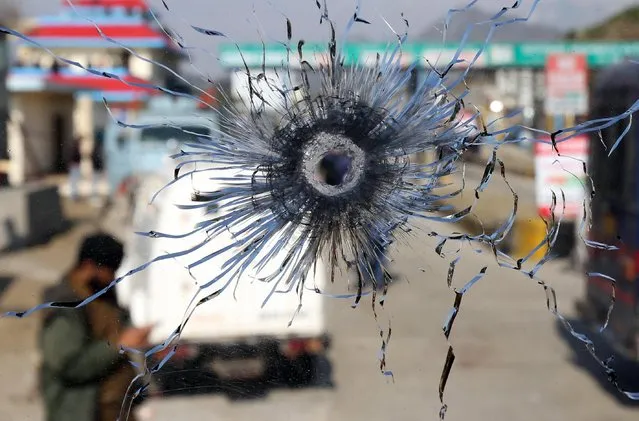 A bullet hole is seen in the windscreen of a truck which was used by suspected militants, at the site of a gun battle at Nagrota, on the outskirts of Jammu, January 31, 2020. (Photo by Mukesh Gupta/Reuters)