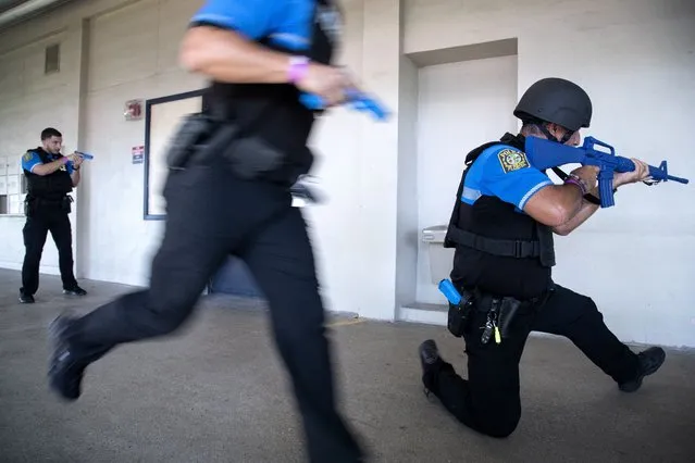 Miami-Dade Police officers participate in a functional active shooter drill at the Hialeah Senior High School in Hialeah, Florida, USA, 03 August 2022. According to the organizers, the Miami-Dade Schools Police Department conducted a large-scale active shooter/mass casualty functional drill to assess the capabilities of various internal and external district resources, including the Miami-Dade Schools Police Department, local hospitals, local law enforcement agencies, and other critical District Divisions. (Photo by Cristobal Herrera-Ulashkevich/EPA/EFE)