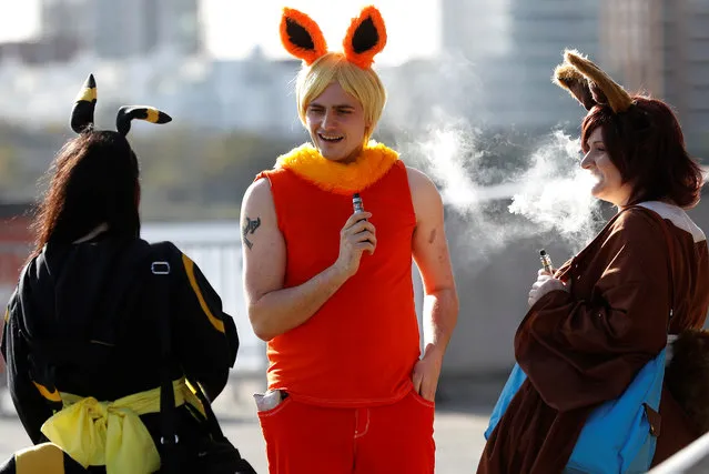 Visitors in costume use their vapes before entering the London Comic Con, at the ExCel exhibition centre in east London, Britain on October 27, 2017. (Photo by Peter Nicholls/Reuters)