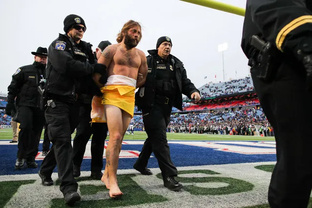 A streaker is escorted off the field during the fourth quarter between the Buffalo Bills and New Orleans Saints on November 12, 2017 at New Era Field in Orchard Park, New York. (Photo by Brett Carlsen/Getty Images)