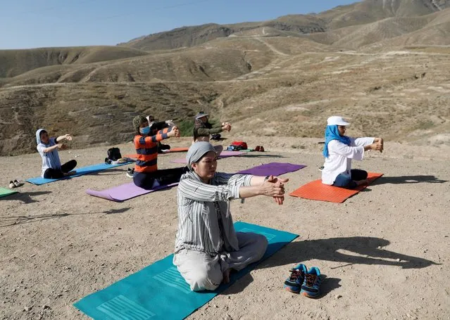 Afghan women perform yoga on a hilltop on International Yoga Day on the outskirts of Kabul, Afghanistan on June 21, 2020. (Photo by Mohammad Ismail/Reuters)