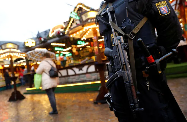 German riot police with submachine guns patrol the Christmas market prior to its official opening in Frankfurt, Germany, November 27, 2017. (Photo by Kai Pfaffenbach/Reuters)