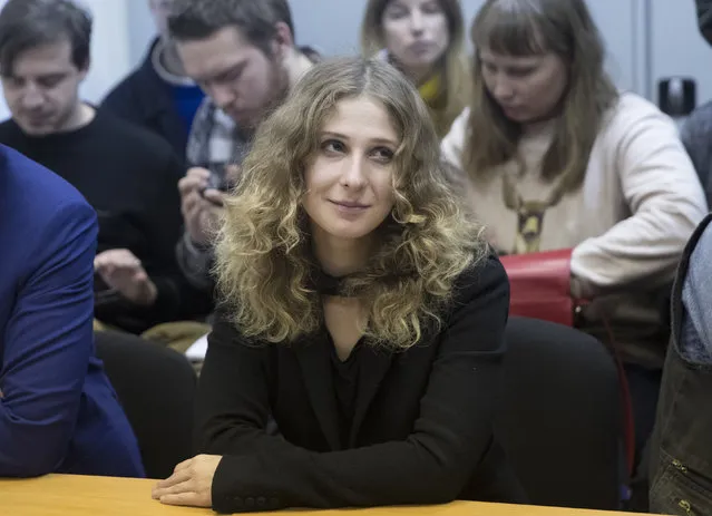 Russian activist of the feminist protest group p*ssy Riot Maria Alekhina listens in a court room in Moscow, Thursday, December 21, 2017. Alekhina, member of the punk band p*ssy Riot, was detained on Wednesday for a protest outside the headquarters of Russia's main security agency and was sentenced on Thursday to 40 hours of community work. (Photo by Pavel Golovkin/AP Photo)