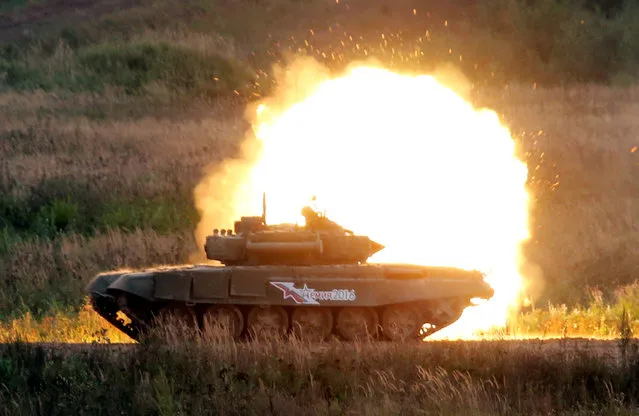 A Russian battle tank fires during a demonstration at the international military-technical forum “ARMY-2016” in Moscow region, Russia, September 6, 2016. (Photo by Maxim Zmeyev/Reuters)