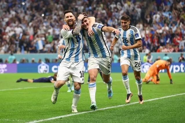 Julian Alvarez of Argentina celebrates with team mates Lionel Messi after scoring his 2nd goal ,during the FIFA World Cup Qatar 2022 semi final match between Argentina and Croatia at Lusail Stadium on December 13, 2022 in Lusail City, Qatar. (Photo by Carl Recine/Reuters)