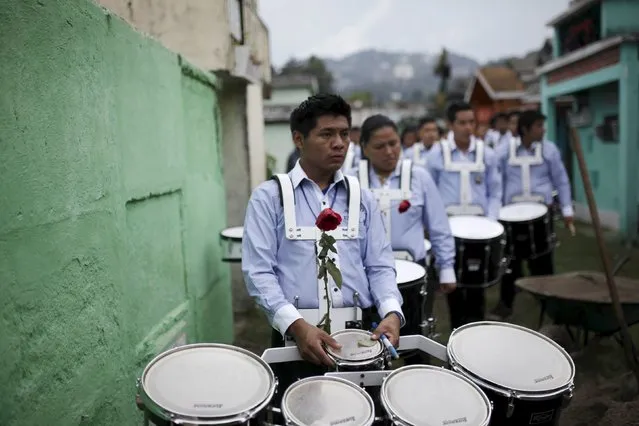 Bandmates participate in the funeral of Bryan Sandoval, a mudslide victim in Santa Catarina Pinula, on the outskirts of Guatemala City, October 4, 2015. (Photo by Josue Decavele/Reuters)