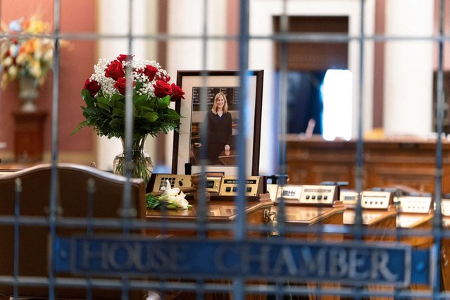Flowers and a portrait of slain Democratic state lawmaker Melissa Hortman lie on Hortman's desk in the Minnesota House Chambers, in St. Paul, Minnesota on June 16, 2025. (Photo by Tim Evans/Reuters)