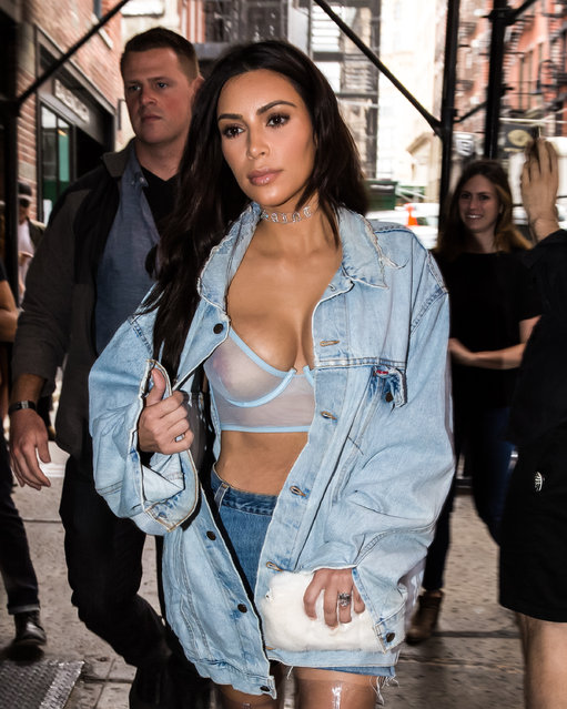 Kim Kardashian is not shy about showing off some skin as she steps out in see-through bra in New York City on September 19, 2016. Kardashian is reportedly wearing a jean jacket from husband Kanye West's Pablo Collection and accessorised her look with a PVC choker with the word “Saint”. (Photo by Allan Bregg/Splash News)