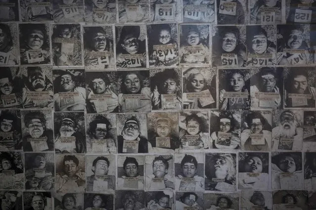 A panel displays pictures of residents who died in the 1984 Bhopal disaster at the forensic department of a hospital in Bhopal November 14, 2014. (Photo by Danish Siddiqui/Reuters)