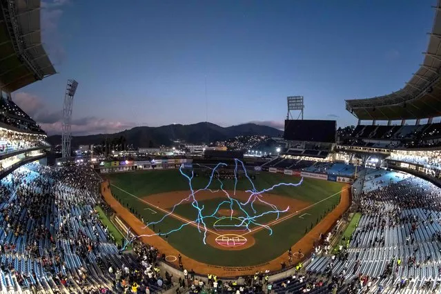 A light show takes place during the opening ceremony of the baseball Caribbean Series in Caracas, Venezuela, 02 February 2023. Thousands of spectators attended the opening ceremony of the 65th edition of the Caribbean Series, held in a new stadium in Caracas. (Photo by Miguel Gutierrez/EPA)