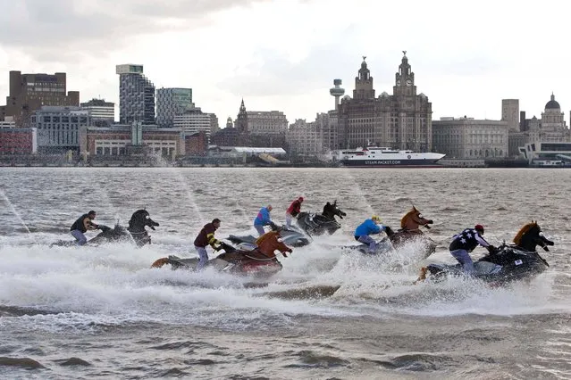 Jet Skis dressed as horses with the riders wearing the colours of the jockey silks due to race in Saturday's Grand National at Aintree, take part in The Coral National, a 500 metre race on the River Mersey in Liverpool, on April 4, 2013. (Photo by Bob Collier/PA Wire)