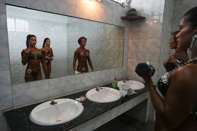 Female contestants prepare at backstage before their model physique competition to mark International Olympic Day at the Myanmar Convention Center in Yangon, Myanmar, Saturday, June 28, 2025. (Photo by Thein Zaw/AP Photo)