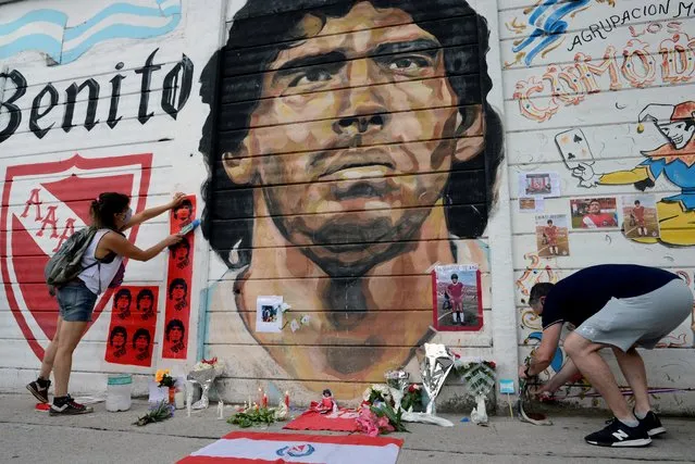 People gather to mourn the death of soccer legend Diego Armando Maradona, outside the Diego Armando Maradona stadium, in Buenos Aires, Argentina, November 25, 2020. (Photo by Matias Baglietto/Reuters)