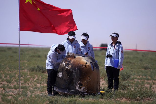 The return capsule of the Chang'e-6 probe lands at the designated landing area on June 25, 2024 in Siziwang Banner, Ulanqab City, Inner Mongolia Autonomous Region of China. The returner of the Chang'e-6 probe touched down on Earth on June 25, bringing back the world's first samples collected from the moon's far side, and marking another remarkable achievement in China's space exploration endeavors. (Photo by VCG/VCG via Getty Images)
